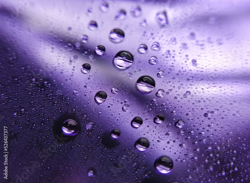 Droplets on purple glass floor 