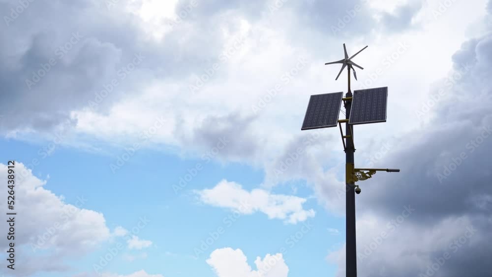 pole with solar panel and wind direction