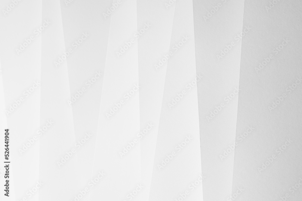 White abstract geometric background with soft light paper inclined vertical lines or surfaces with gradient as pattern. Simple elegant modern backdrop in minimal style. White abstract geometric background with soft light paper inclined vertical lines or surfaces with gradient as pattern. Simple elegant modern backdrop in minimal style.