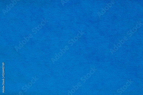 Blue velvet fabric surface from above. velvet texture violet color background. expensive luxury fabric, material, wallpaper.
