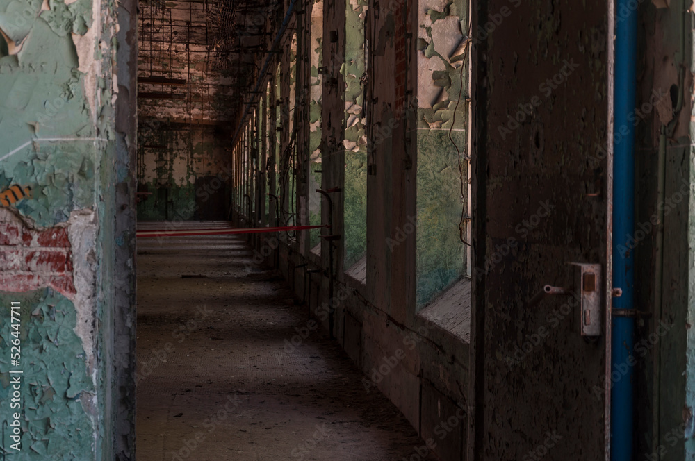 An abandoned old red brick factory - a spinning mill in Poland An abandoned old red brick factory - a spinning mill in Poland