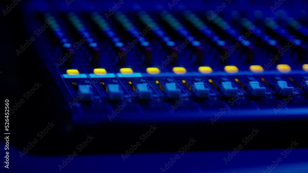 Mixing Console Faders in Use at a Professional Recording Studio Mixing Console Faders in Use at a Professional Recording Studio