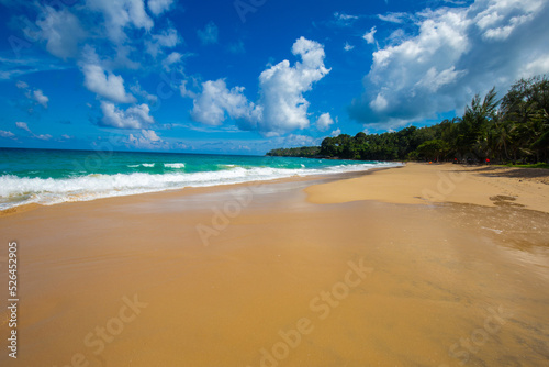 Exotic idyllic white sand sea wave beach blue sky with cloud