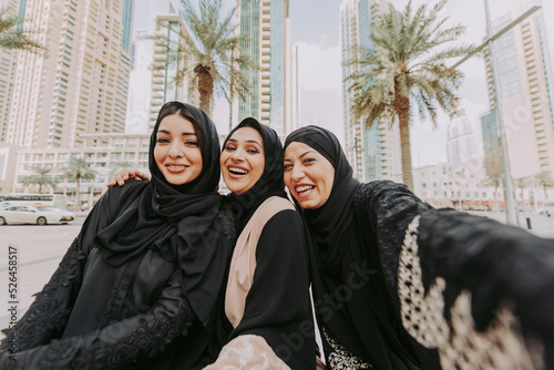 Photography Arabic women wearing traditional abaya dress meeting and having fun in Dubai - H