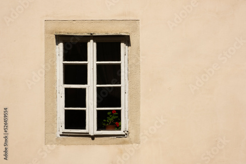 Old window on abandoned residentual house close up shot on a sunny day.