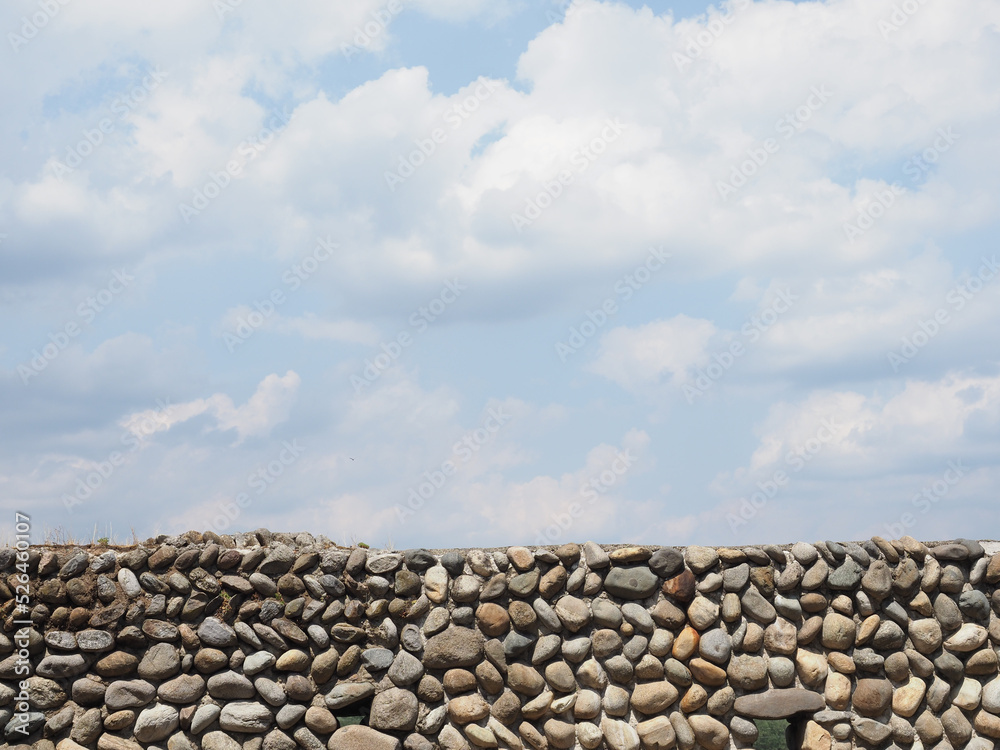 grey stone wall and sky background