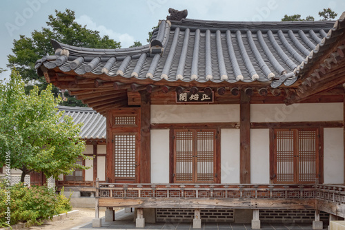 Traditional brown wood Korean architecture temple building complex Gyeongbokgung Palace in Seoul South Korea	 photo