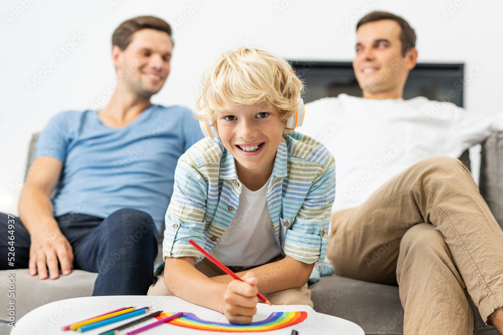 Lgbt family, gay couple with adopted son - LGBTQ rainbow family portrait at home Lgbt family, gay couple with adopted son - LGBTQ rainbow family portrait at home