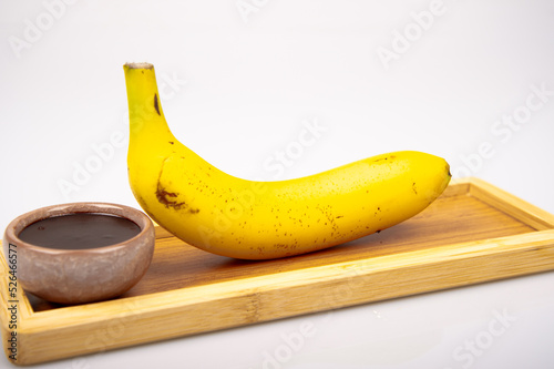 Organic banana on white background.