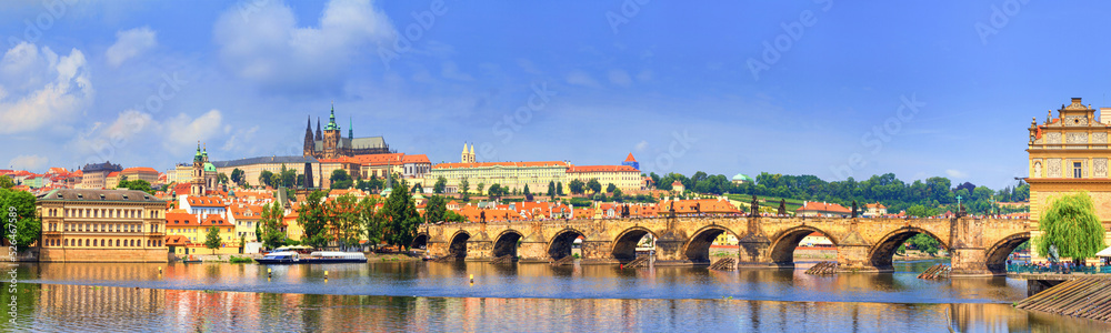 City summer landscape, banner - view of the Charles Bridge and castle complex Prague Castle in the historical center of Prague, Czech Republic