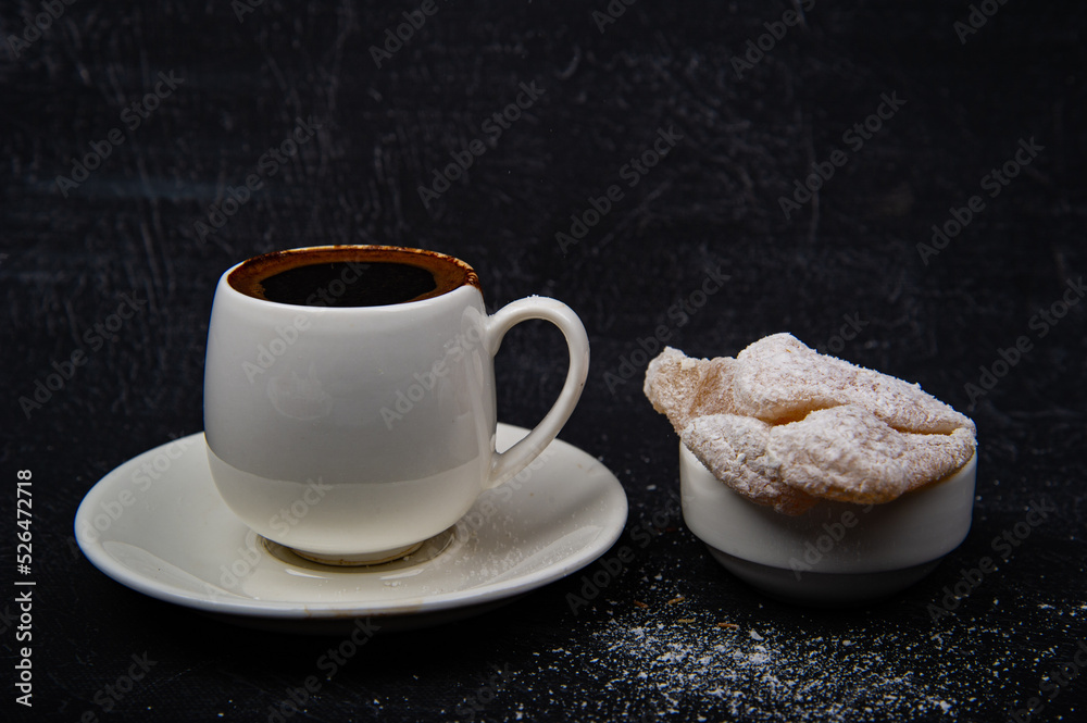 Turkish coffee and Turkish delight on black background. Turkish coffee and Turkish delight on black background.