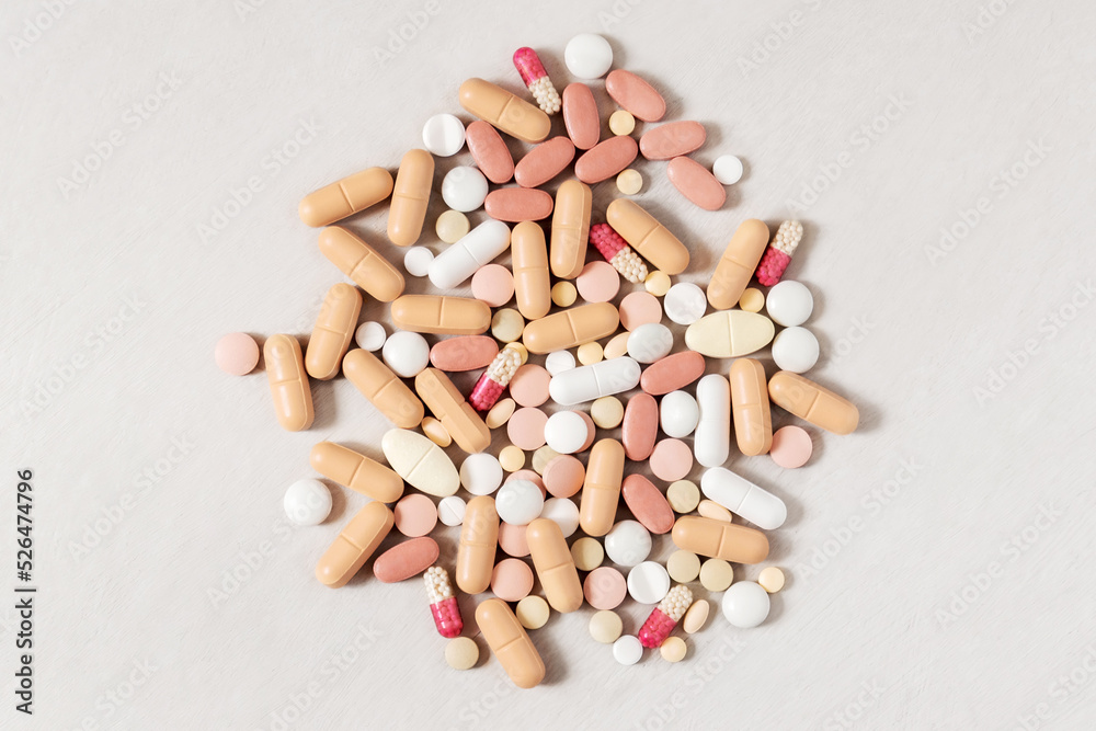 Medical various pills on light background. Close up top view. Medical various pills on light background. Close up top view.