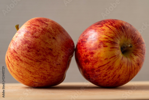 pair of  apple with grey background, close up view, envy apples.
