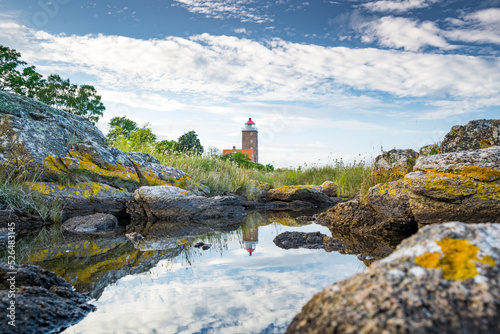 lighthouse on the coast of the sea on island bornholm denmark photo