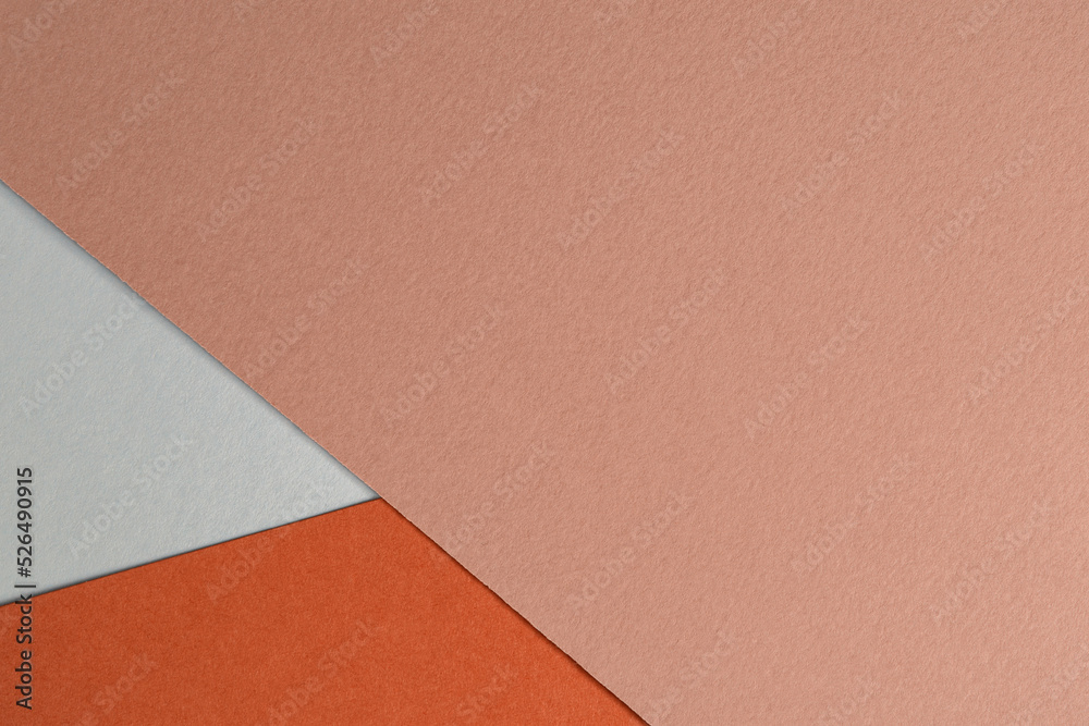 Fototapeta premium Abstract background from craft paper in pink, orange and white colors. Colored paper texture background