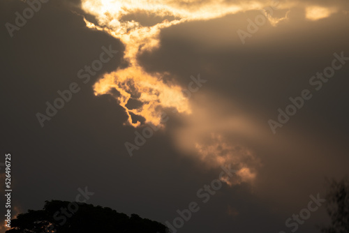 The morning sun shining through the stome clouds photo