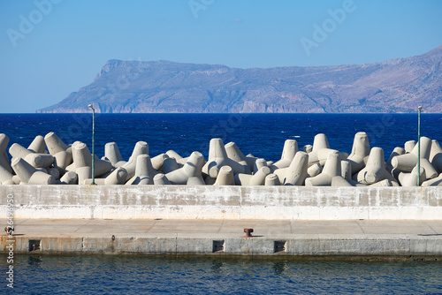 Tetrapod breakwater in port and the blue sea photo