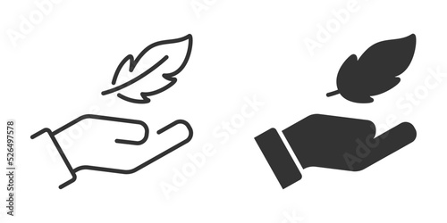 Feather in hand icon. Lightweight icon. Vector illustration. photo