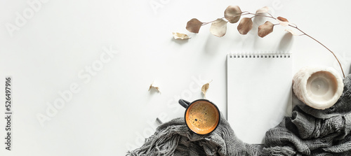 Home desk table with plaid, coffee cup on white background