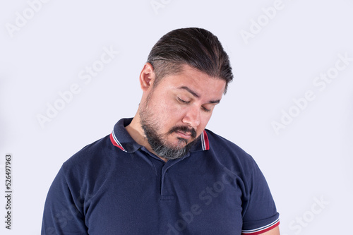 A man dozes off while still standing. Possibly drunk with a hangover, or sleep deprived. Looking a bit funny. Isolated on a white background. photo