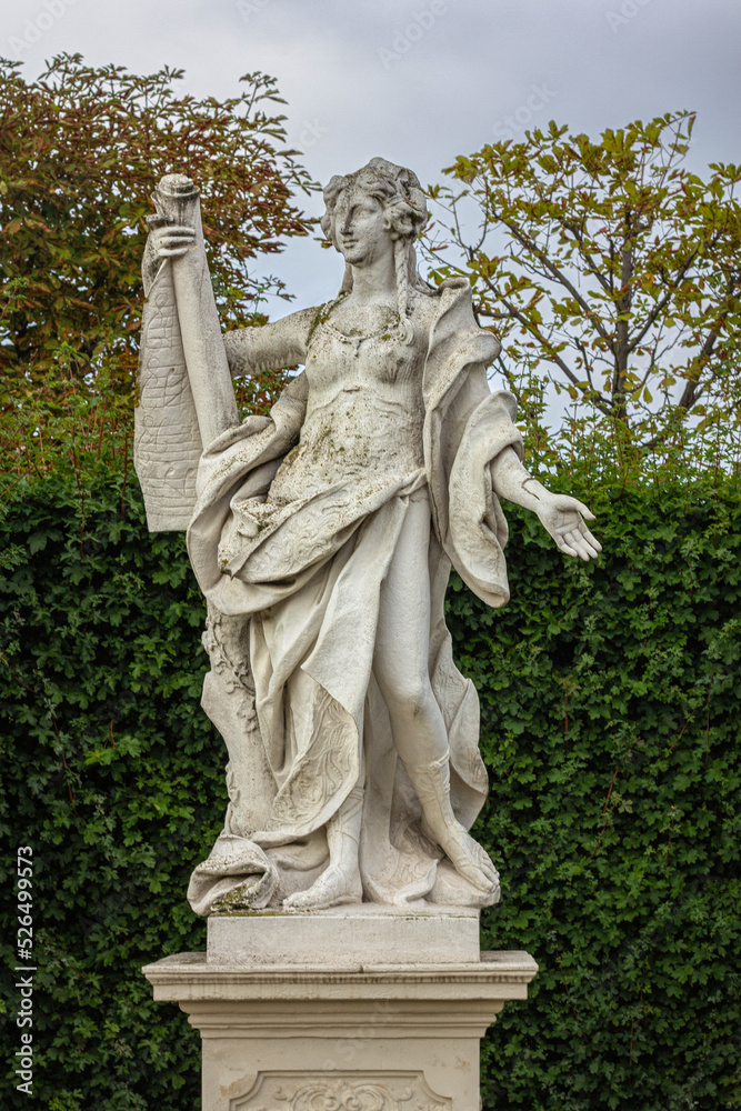 Antique stone statues in the garden of Belvedere Palace, Vienna	