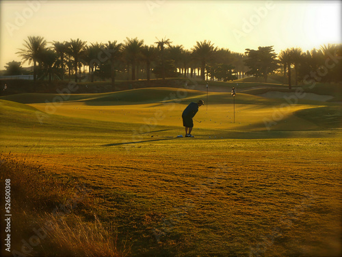 Golf practice at sun rise