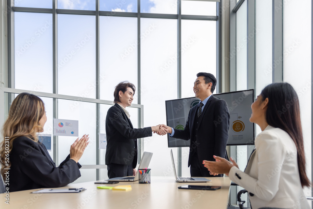 Business group in meeting having hand shake for business deal agreement or celebrating success in boardroom modern office Business group in meeting having hand shake for business deal agreement or celebrating success in boardroom modern office