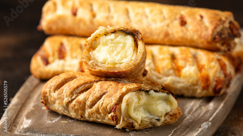 Cheese and onion puff pastry rolls. Vegetarian food, snack © grinchh