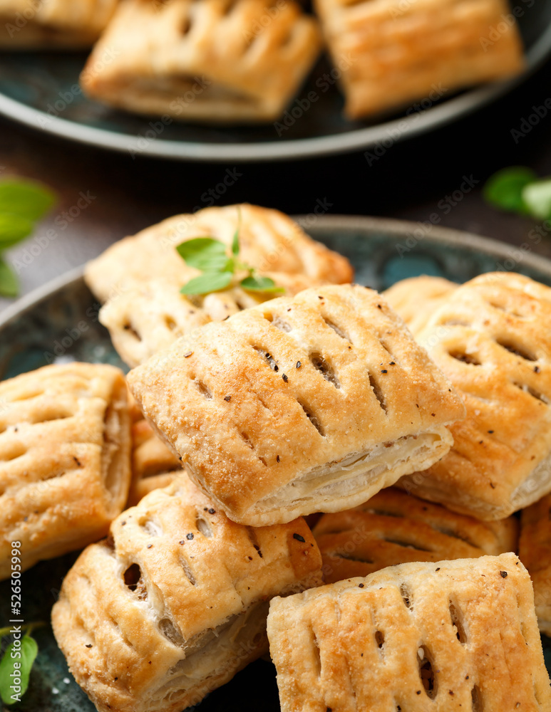 Mini beef patties with vegetables and red wine wrapped in puff pastry Mini beef patties with vegetables and red wine wrapped in puff pastry