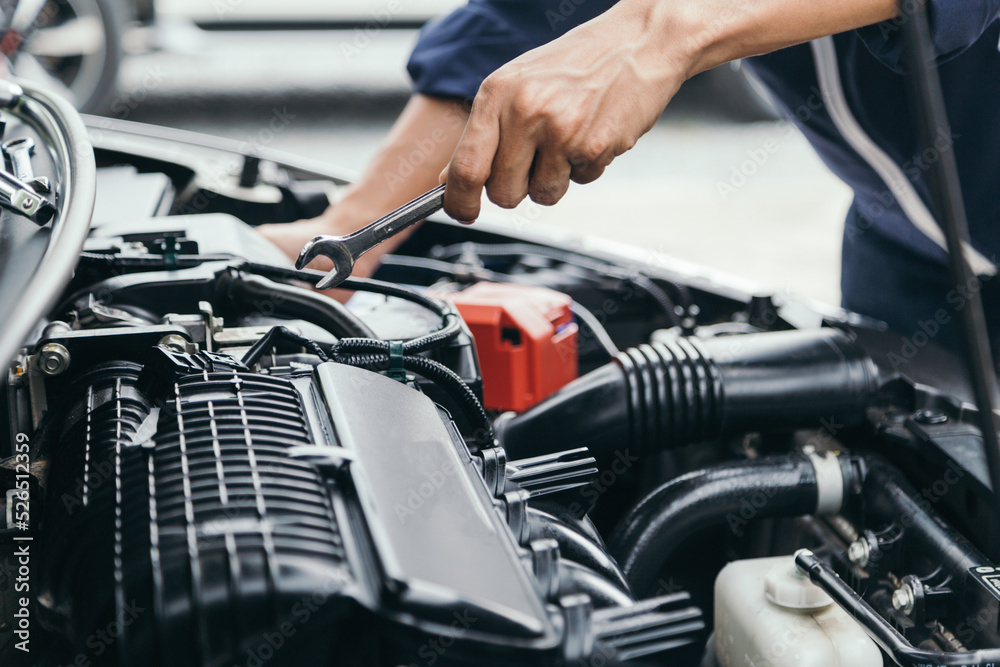 Automobile mechanic repairman hands repairing a car engine automotive workshop with a wrench, car service and maintenance,Repair service. Automobile mechanic repairman hands repairing a car engine automotive workshop with a wrench, car service and maintenance,Repair service.
