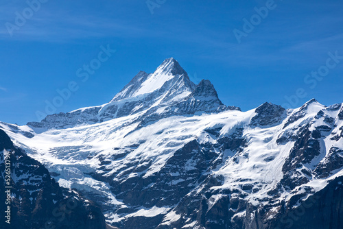 Peak of the snow covered Jungfrau mountain in the Bernese Alps in Switzerland. Jungfrau is also known as the Top of Europe
