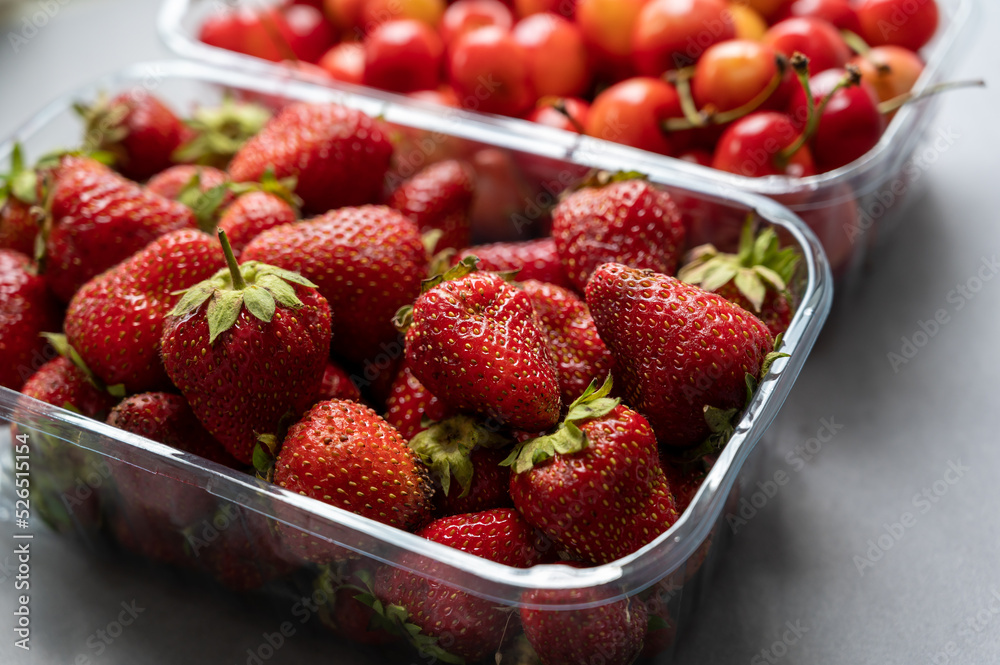 Ripe strawberries and sweet cherries Ripe strawberries and sweet cherries