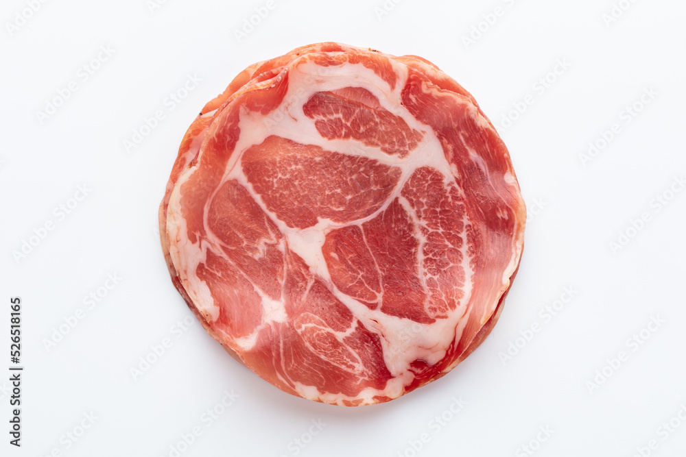 Italian prosciutto crudo or jamon. Raw ham. Isolated on white background. Italian prosciutto crudo or jamon. Raw ham. Isolated on white background.