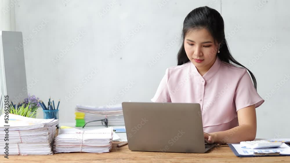 Businesswoman at office desk working on laptop and calculating accounting budget for financial planning for budget allocation. Businesswoman at office desk working on laptop and calculating accounting budget for financial planning for budget allocation.
