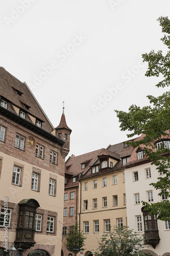 Old historic architecture in Nuremberg, Germany. Traditional European old town buildings with wooden windows, shutters and colourful pastel walls. Aesthetic summer vacation, tourism background