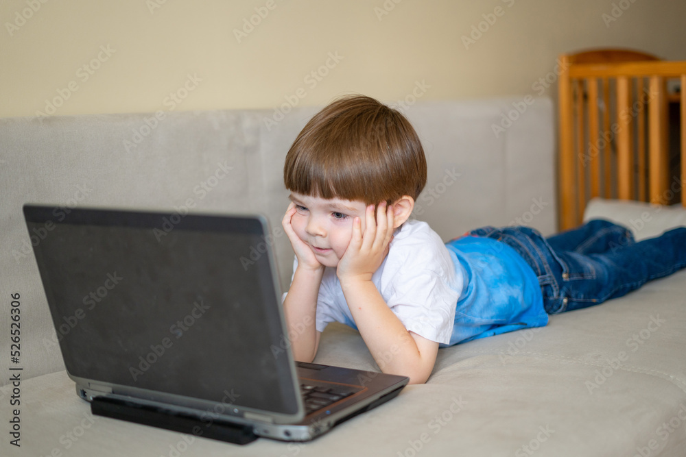 The child plays on a laptop, communicates with friends via video link and does homework
The child plays on a laptop, communicates with friends via video link and does homework