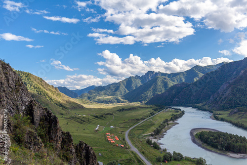 Colorful view of the mountains and the Katun River  with an island in the Altai Mountains  Siberia  Russia. View from the observation deck in the mountains. The concept of recreation and tourism