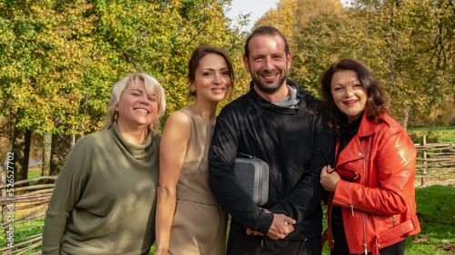 Group of friends having fun in autumn park