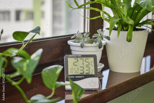 Thermometer hygrometer measuring the optimum temperature and humidity in a house photo