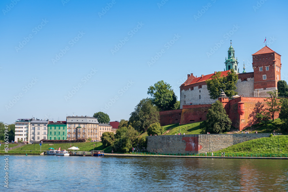 View of the beautiful royal castle at Wawel in Krakow. .Boulevards over the Wisla River