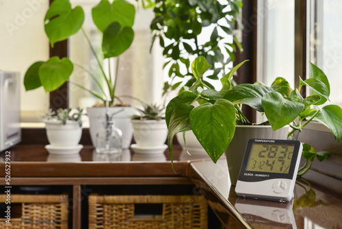 Thermometer hygrometer measuring the optimum temperature and humidity in a house photo