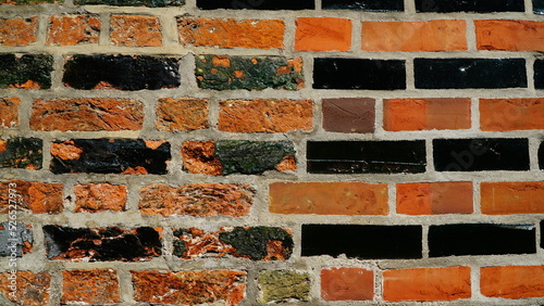 Glazed brick wall: old and restored