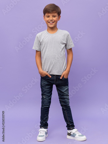 Full body Smiling child with t-shirt isolated on lilac background