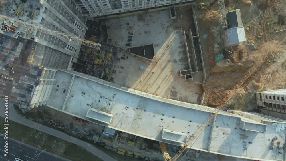 Construction site of a new city block. Construction of multi-storey buildings. Construction site at dawn. Aerial photography. The camera is down. Construction site of a new city block. Construction of multi-storey buildings. Construction site at dawn. Aerial photography. The camera is down.