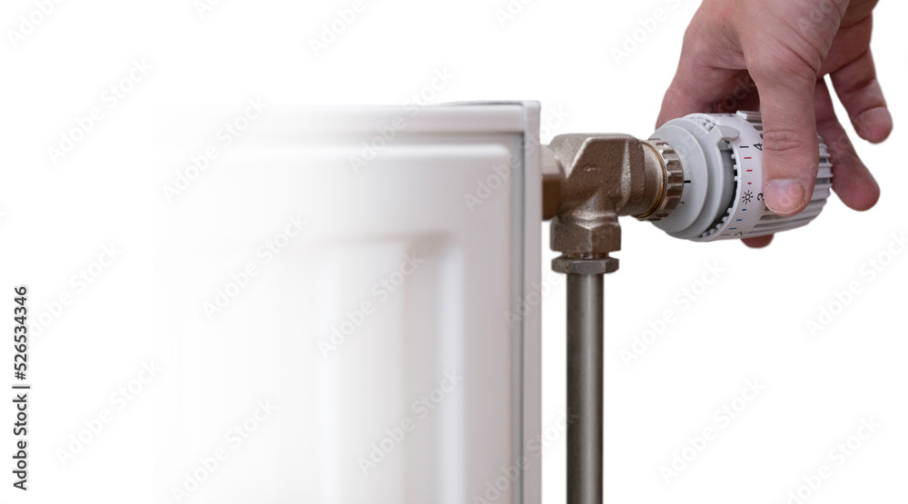 Hand turns the thermostatic tap to turn the heating down. Isolated on white with heating radiator. Left space for text or design Hand turns the thermostatic tap to turn the heating down. Isolated on white with heating radiator. Left space for text or design