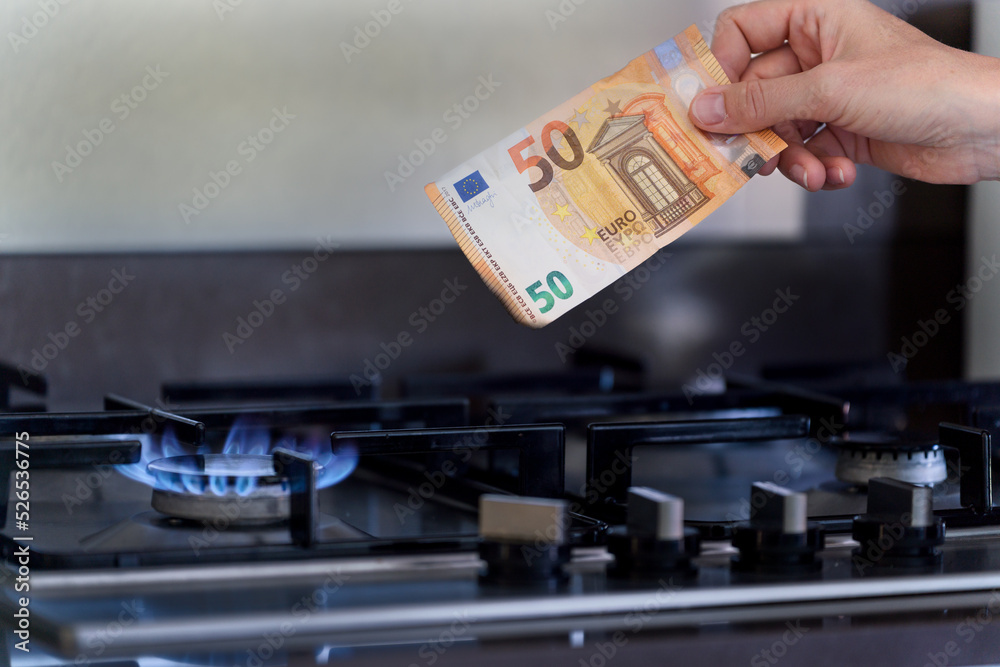 Natural Gas Crisis Inflation, 50 Euro Note is Burning on a stove fired by natural gas.
Natural Gas Crisis Inflation, 50 Euro Note is Burning on a stove fired by natural gas.