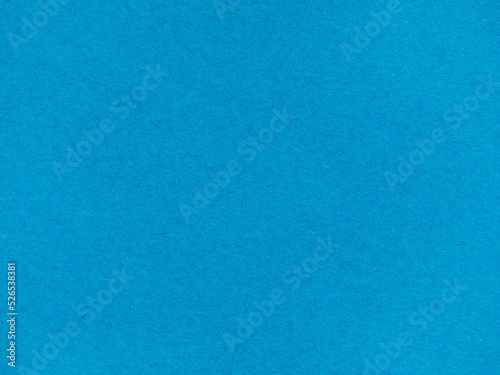 Background with a plain blue paper texture. Textured background made of light blue kraft paper. blue retro paper background. Vintage cardboard texture. Grunge-style drawing paper