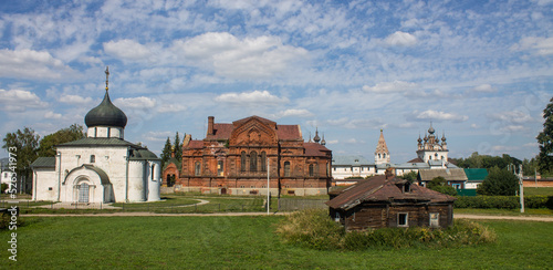 Ancient white-stone St. George's Cathedral in the old town of Yuriev Polsky, Vladimir region, Russia on a clear sunny summer day photo