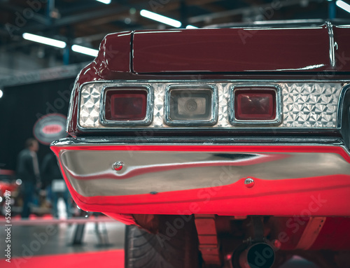 The back of a retro car. Rear light of a vintage car.