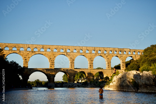 The Magnificent roman "Pont du Gard" bridge and aqueduct at sunset in summer in the south of France. 